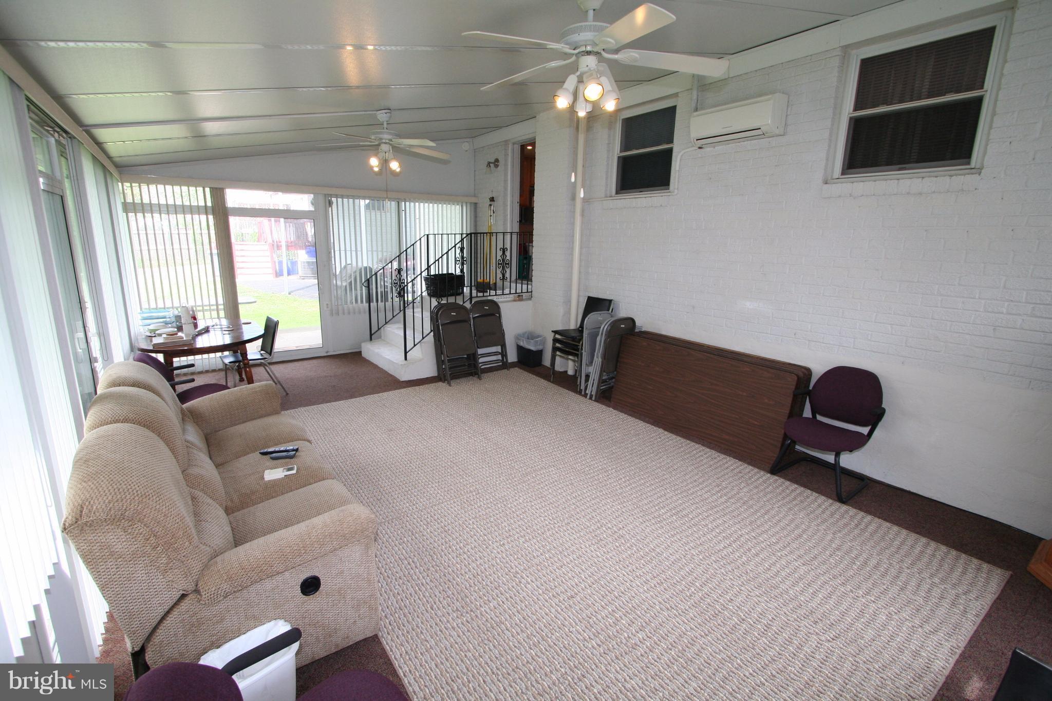 12720 Gould Road Silver Spring, MD 20906 - Photo 17 of 30 a living room with furniture and a flat screen tv