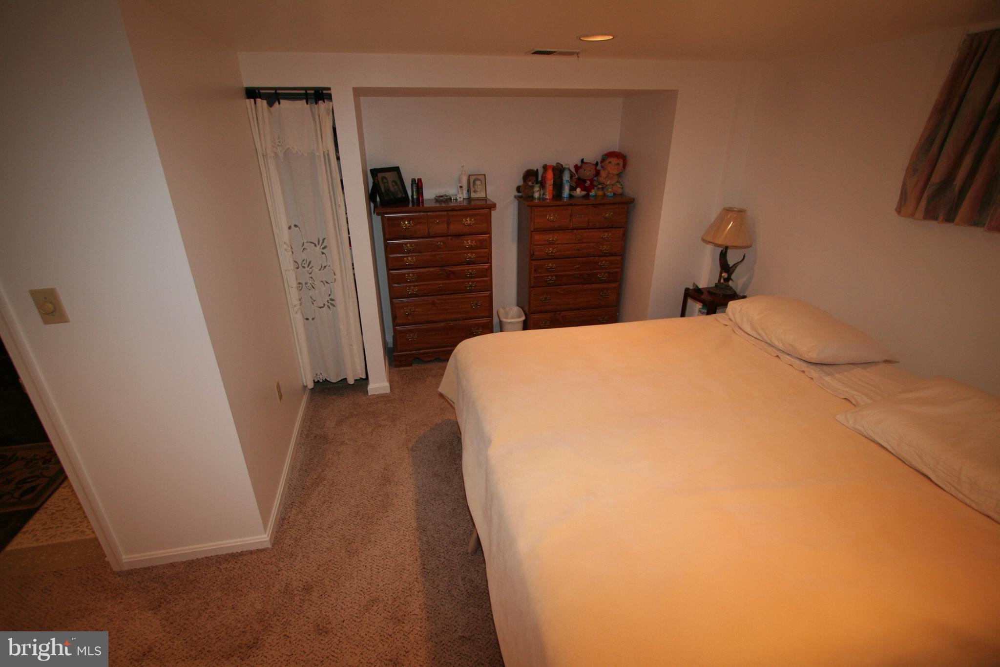 12720 Gould Road Silver Spring, MD 20906 - Photo 19 of 30 a bed room with a bed and a closet