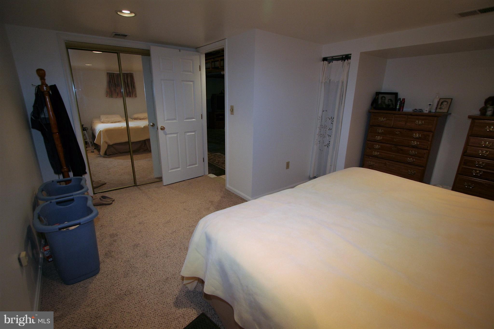 12720 Gould Road Silver Spring, MD 20906 - Photo 20 of 30 a bedroom with a bed and dresser
