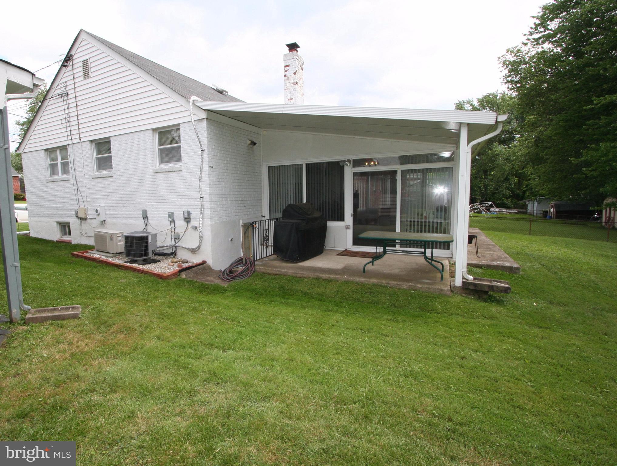 12720 Gould Road Silver Spring, MD 20906 - Photo 3 of 30 a view of a house with backyard porch and sitting area
