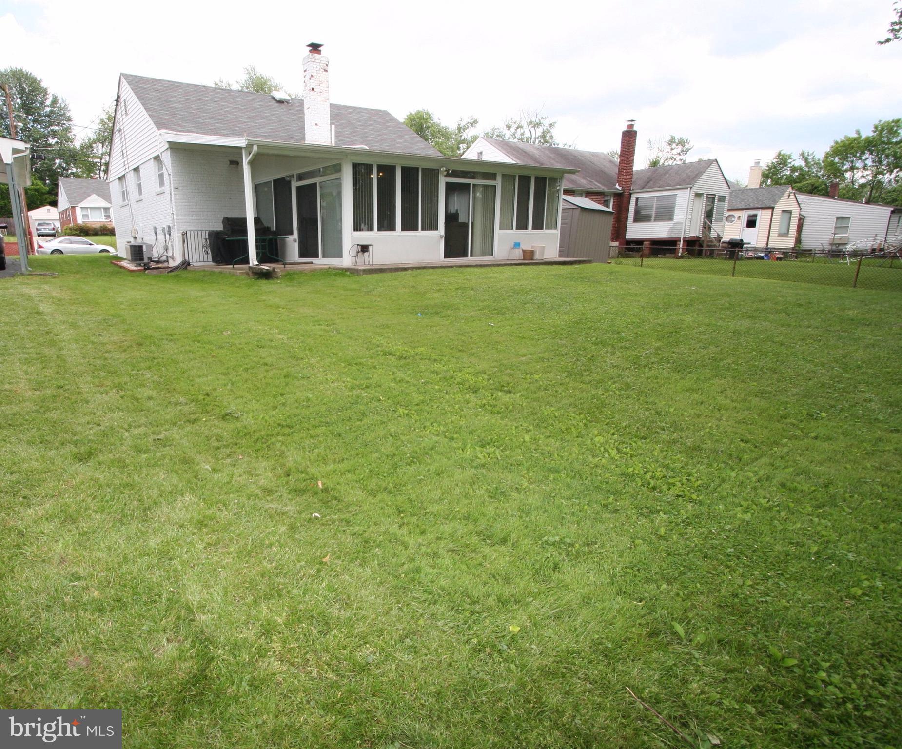12720 Gould Road Silver Spring, MD 20906 - Photo 27 of 30 a front view of a house with a garden