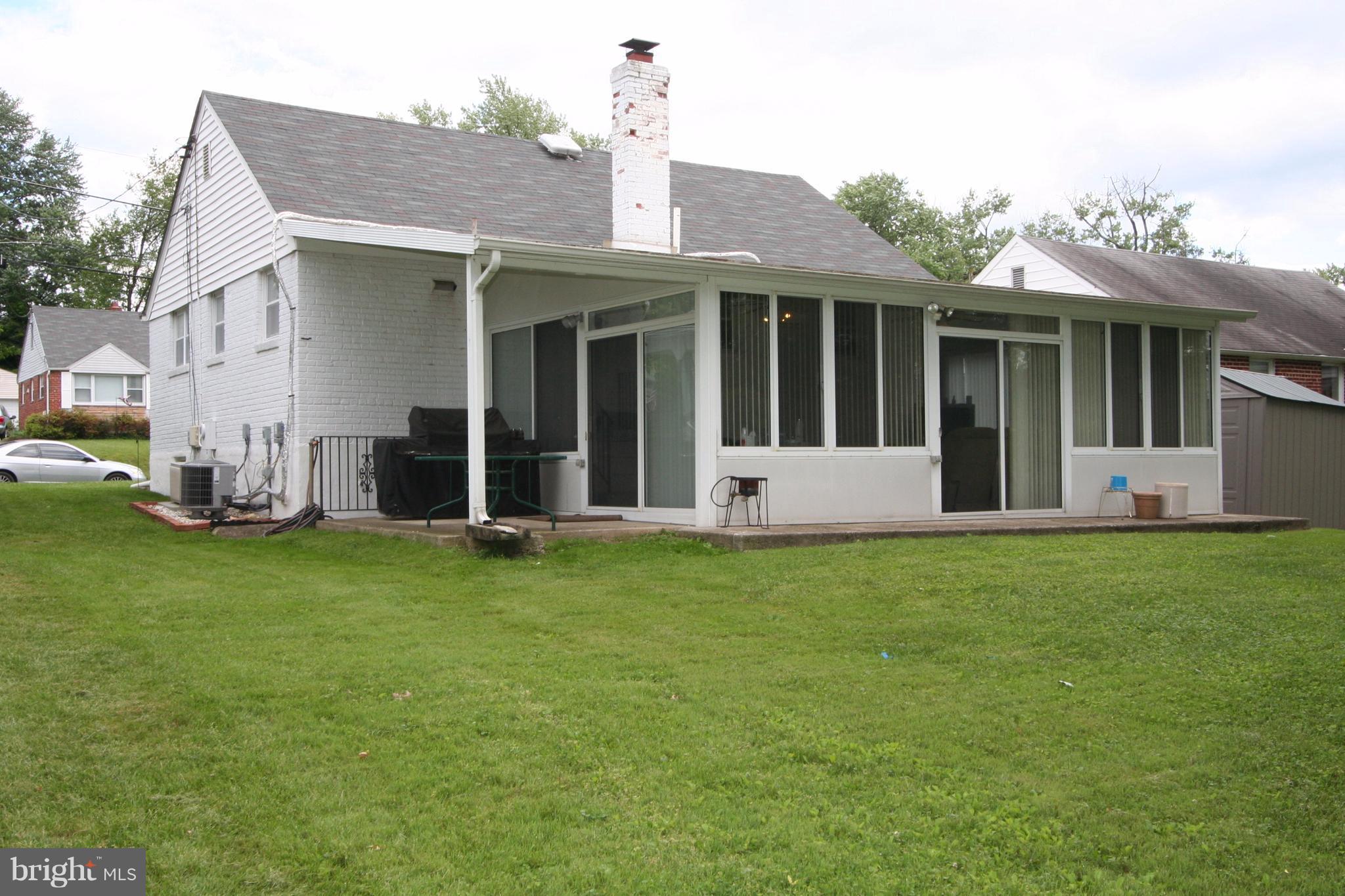 12720 Gould Road Silver Spring, MD 20906 - Photo 28 of 30 a front view of a house with a garden