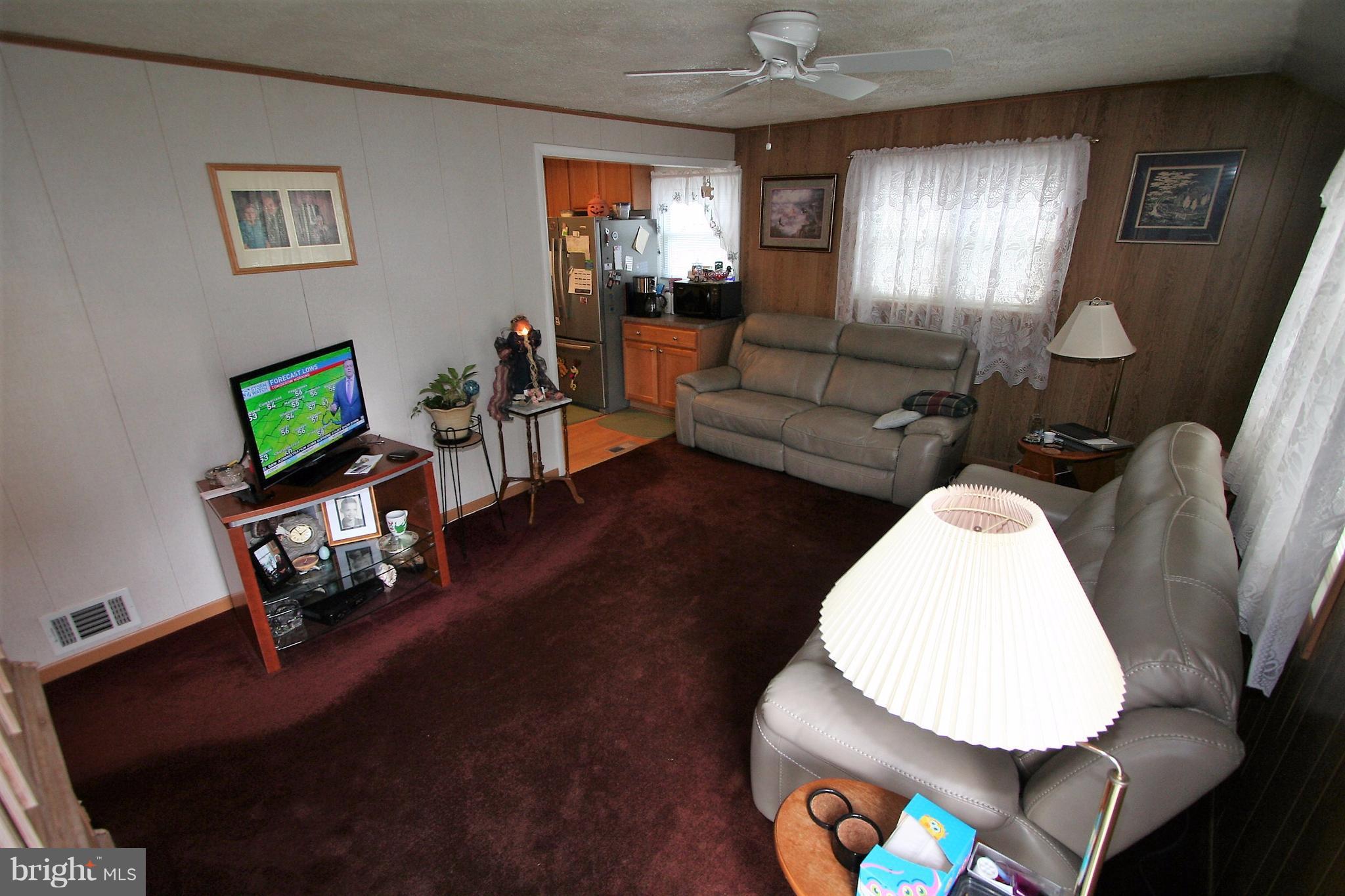 12720 Gould Road Silver Spring, MD 20906 - Photo 4 of 30 a living room with furniture and a wooden floor