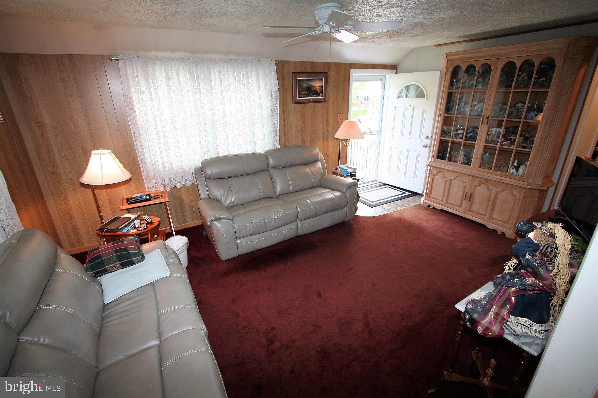 12720 Gould Road Silver Spring, MD 20906 - Photo 5 of 30 a living room with furniture and a window