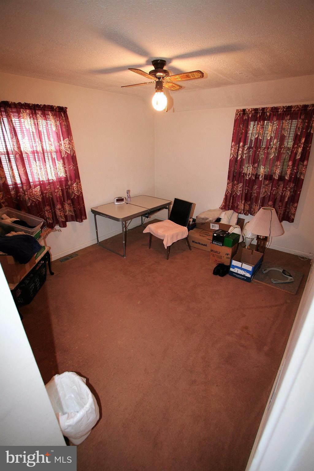12720 Gould Road Silver Spring, MD 20906 - Photo 10 of 30 a room with gym equipment and a mirror