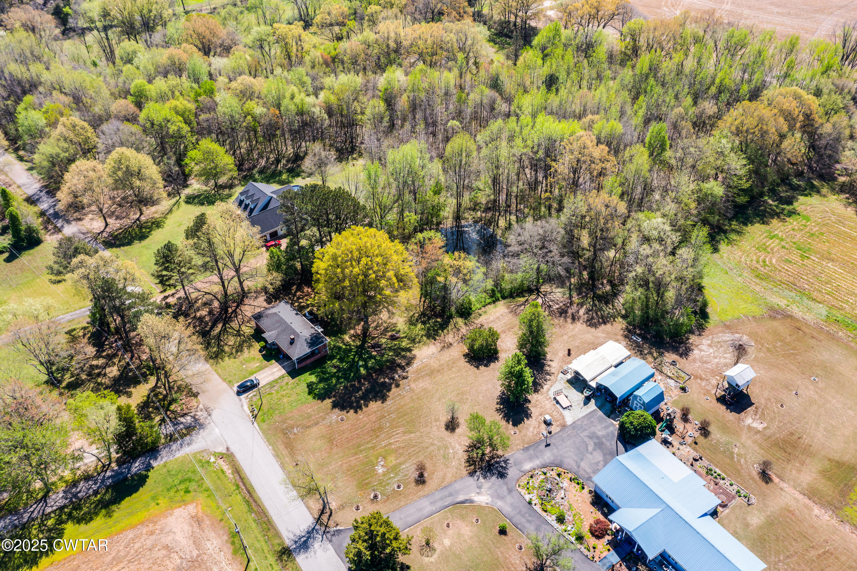 34 Hughes Loop Milan, TN 38358 - Photo 20 of 21 an aerial view of residential houses with outdoor space