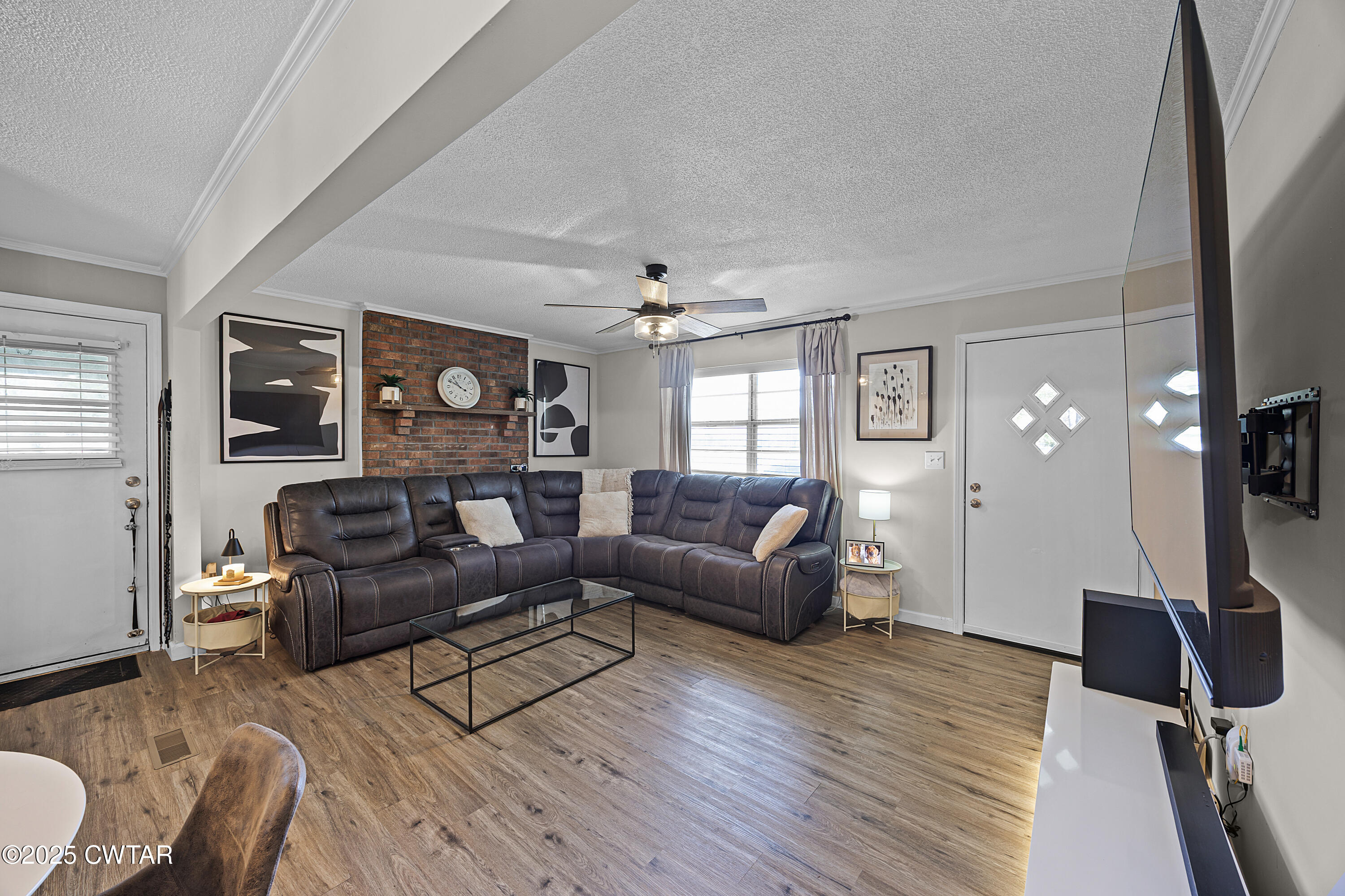 34 Hughes Loop Milan, TN 38358 - Photo 3 of 21 a living room with furniture and a flat screen tv