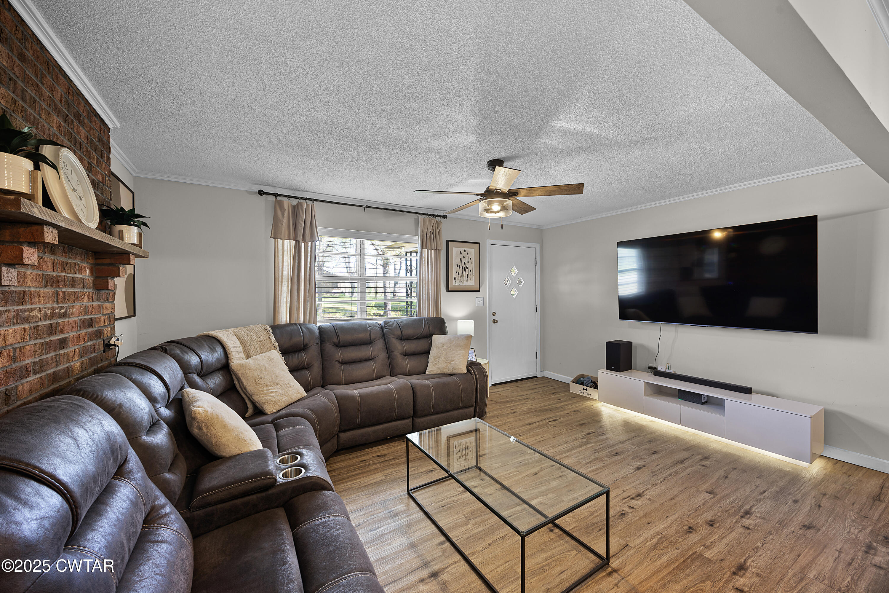 34 Hughes Loop Milan, TN 38358 - Photo 4 of 21 a living room with furniture and a flat screen tv