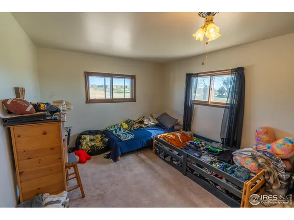 a bedroom with furniture and a window