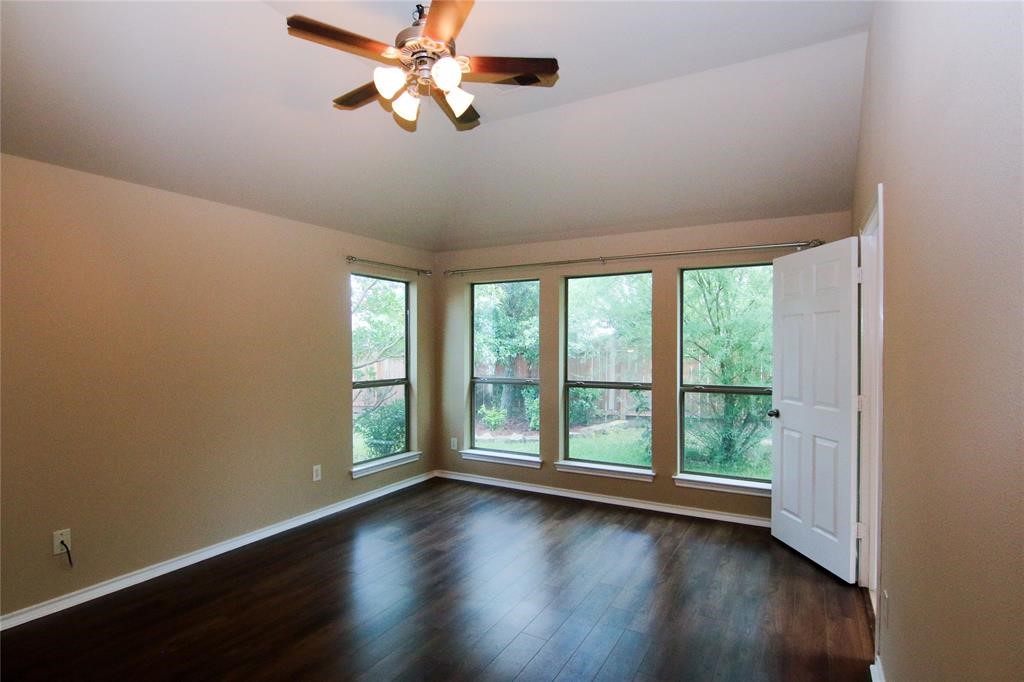 27431 Rebecca Field Lane Spring, TX 77386 - Photo 16 of 26 a view of room with wooden floor and fan