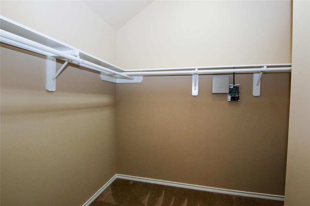 27431 Rebecca Field Lane Spring, TX 77386 - Photo 19 of 26 a view of small space with racks on the wall