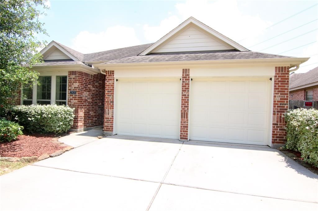 27431 Rebecca Field Lane Spring, TX 77386 - Photo 2 of 26 front view of a house with a yard
