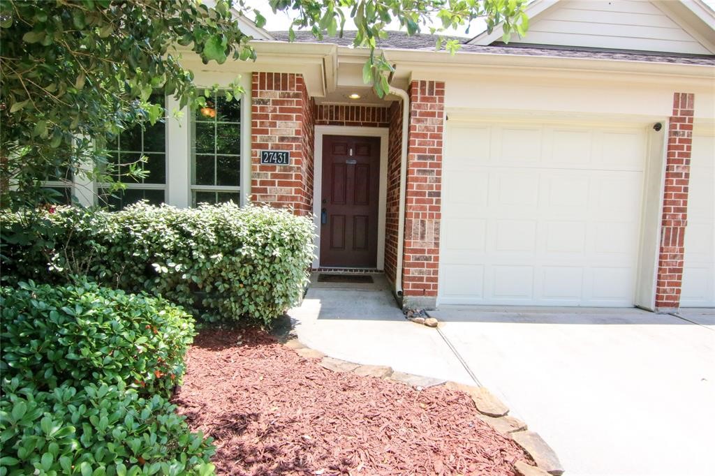 27431 Rebecca Field Lane Spring, TX 77386 - Photo 3 of 26 a view of entryway with garden