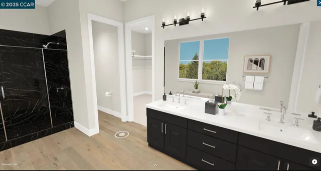 a spacious bathroom with a double vanity sink a large mirror and a shower