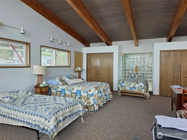 a bedroom with bed and a window