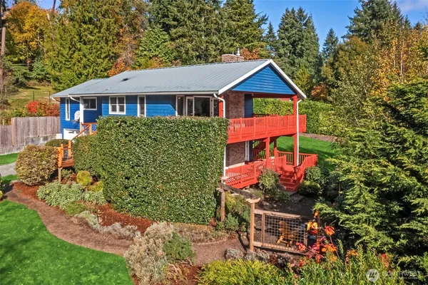 a front view of a house with garden