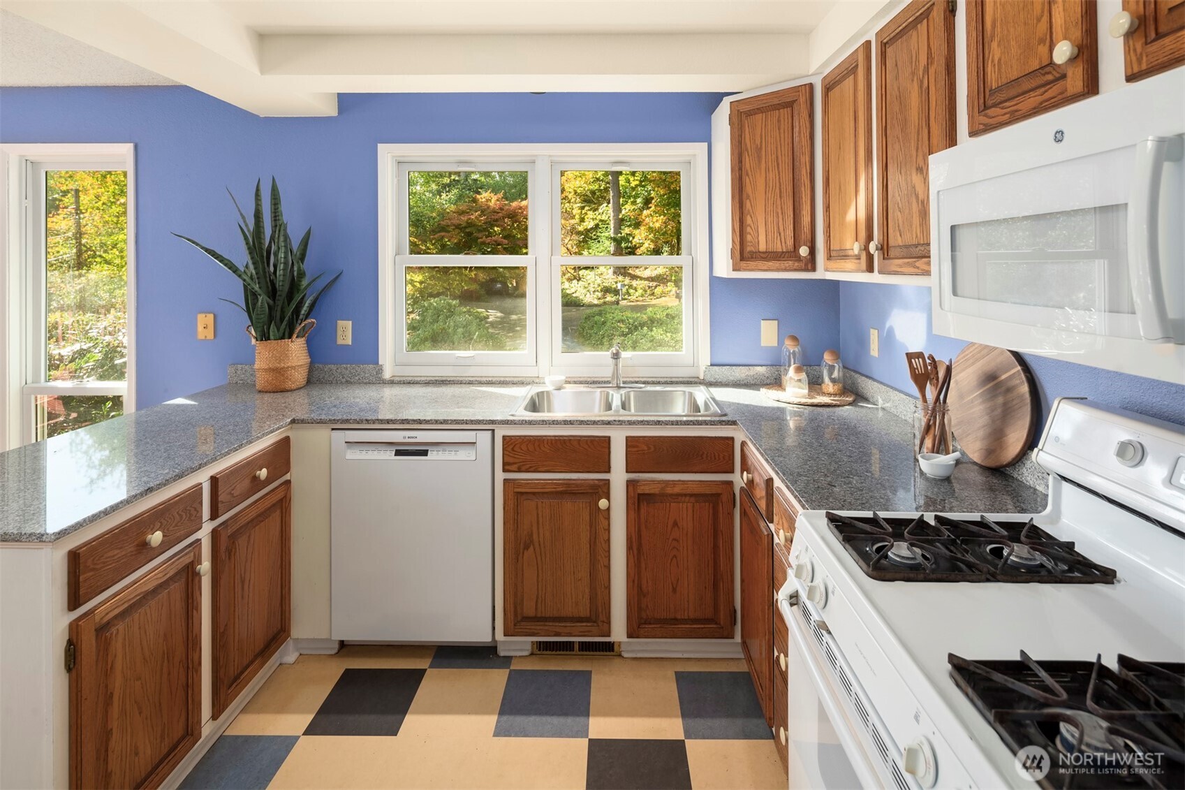 10514 Southwest 110th Street Vashon, WA 98070 - Photo 12 of 38 a kitchen with a stove a sink and a window