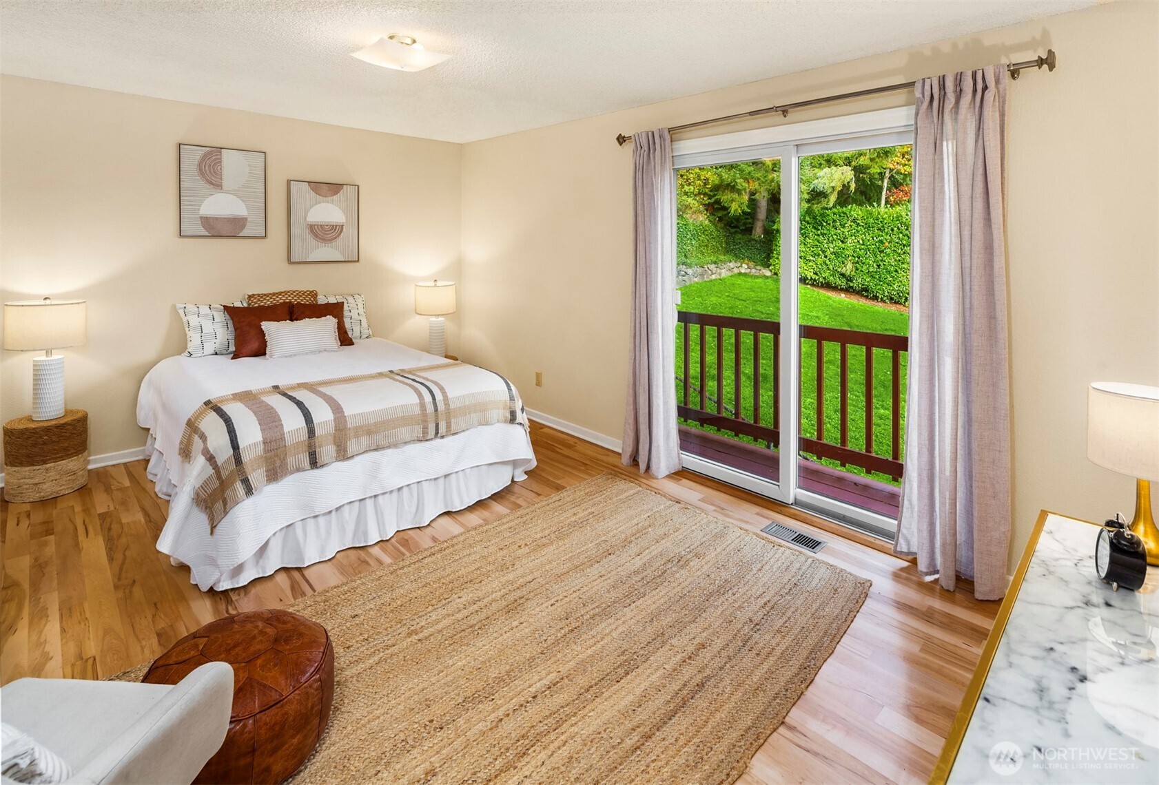 10514 Southwest 110th Street Vashon, WA 98070 - Photo 13 of 38 a bedroom with a bed and a large window