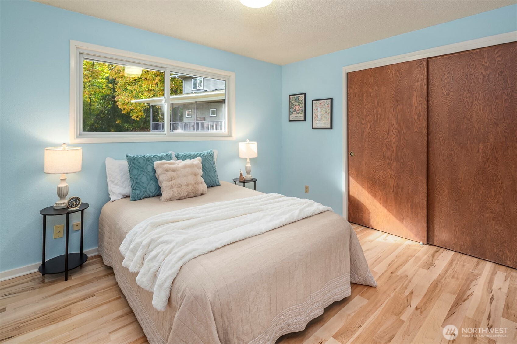 10514 Southwest 110th Street Vashon, WA 98070 - Photo 19 of 38 a bedroom with a bed and a window