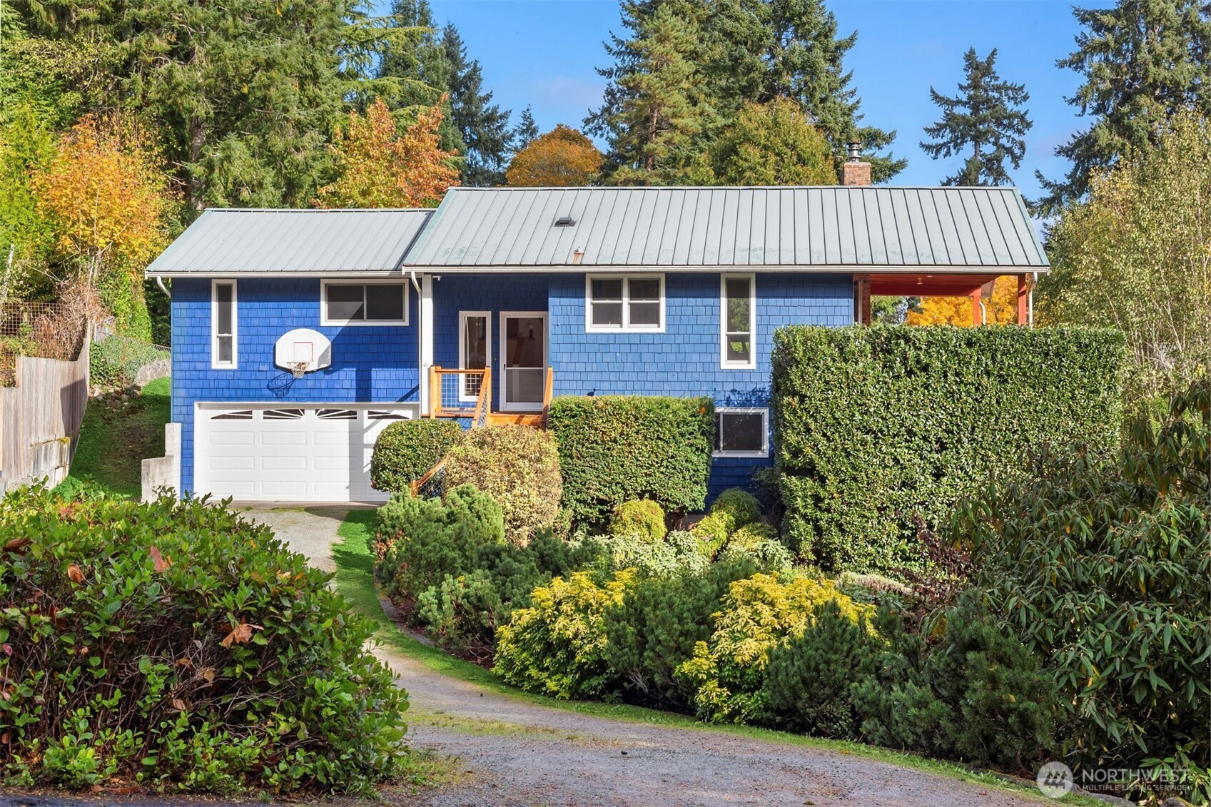 10514 Southwest 110th Street Vashon, WA 98070 - Photo 2 of 38 front view of a house with a yard