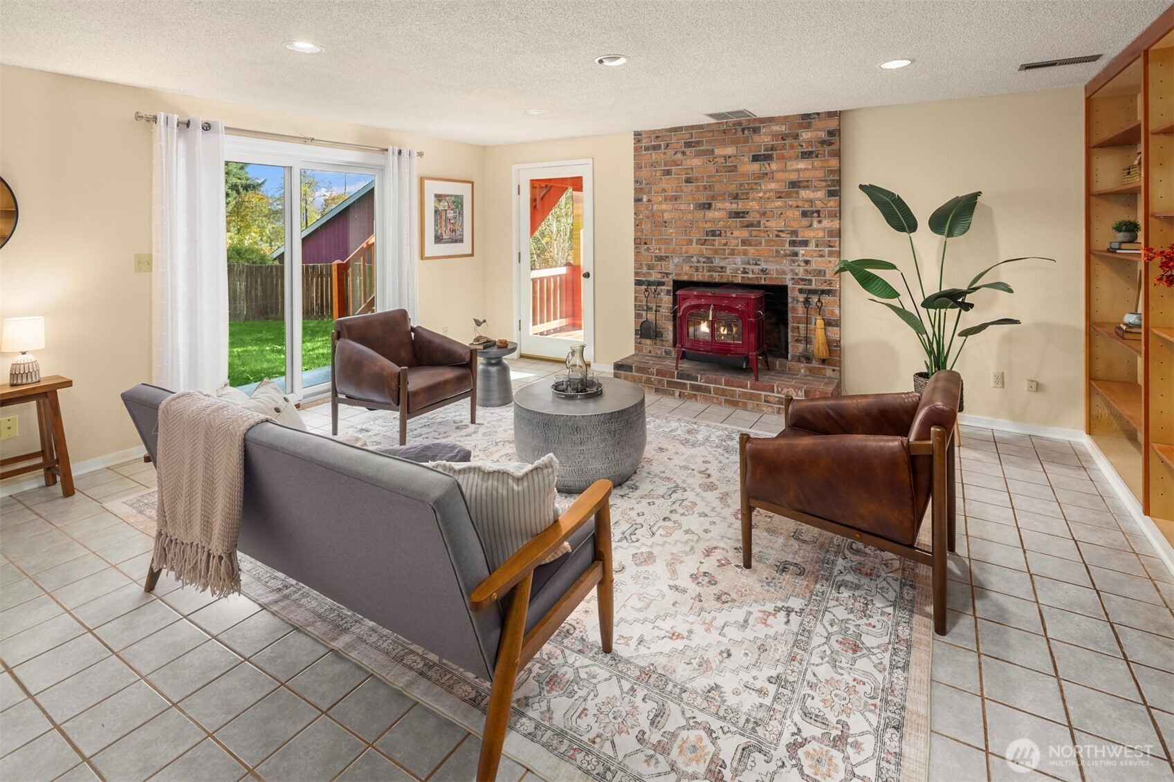 10514 Southwest 110th Street Vashon, WA 98070 - Photo 21 of 38 a living room with furniture and a fireplace