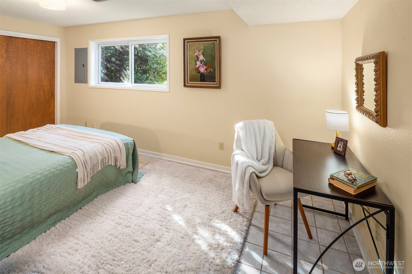 10514 Southwest 110th Street Vashon, WA 98070 - Photo 24 of 38 a bedroom with a bed and a window