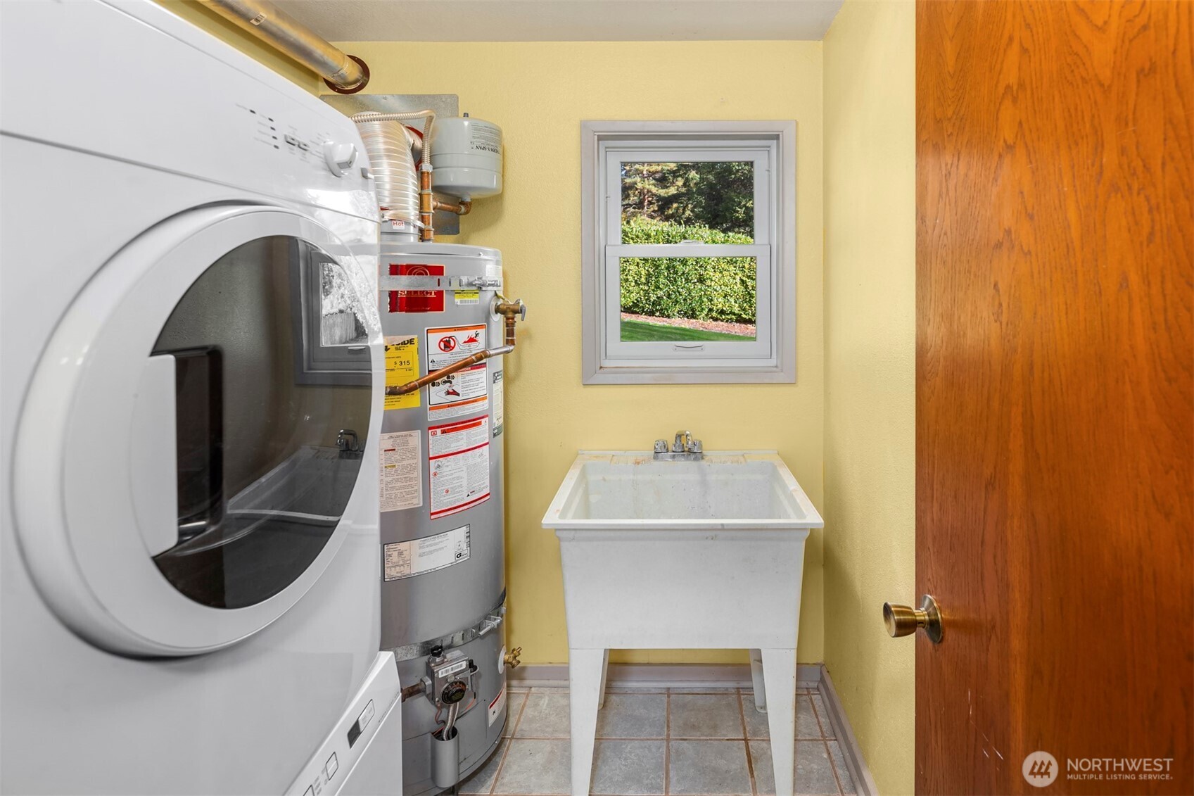 10514 Southwest 110th Street Vashon, WA 98070 - Photo 26 of 38 a utility room with dryer and washer