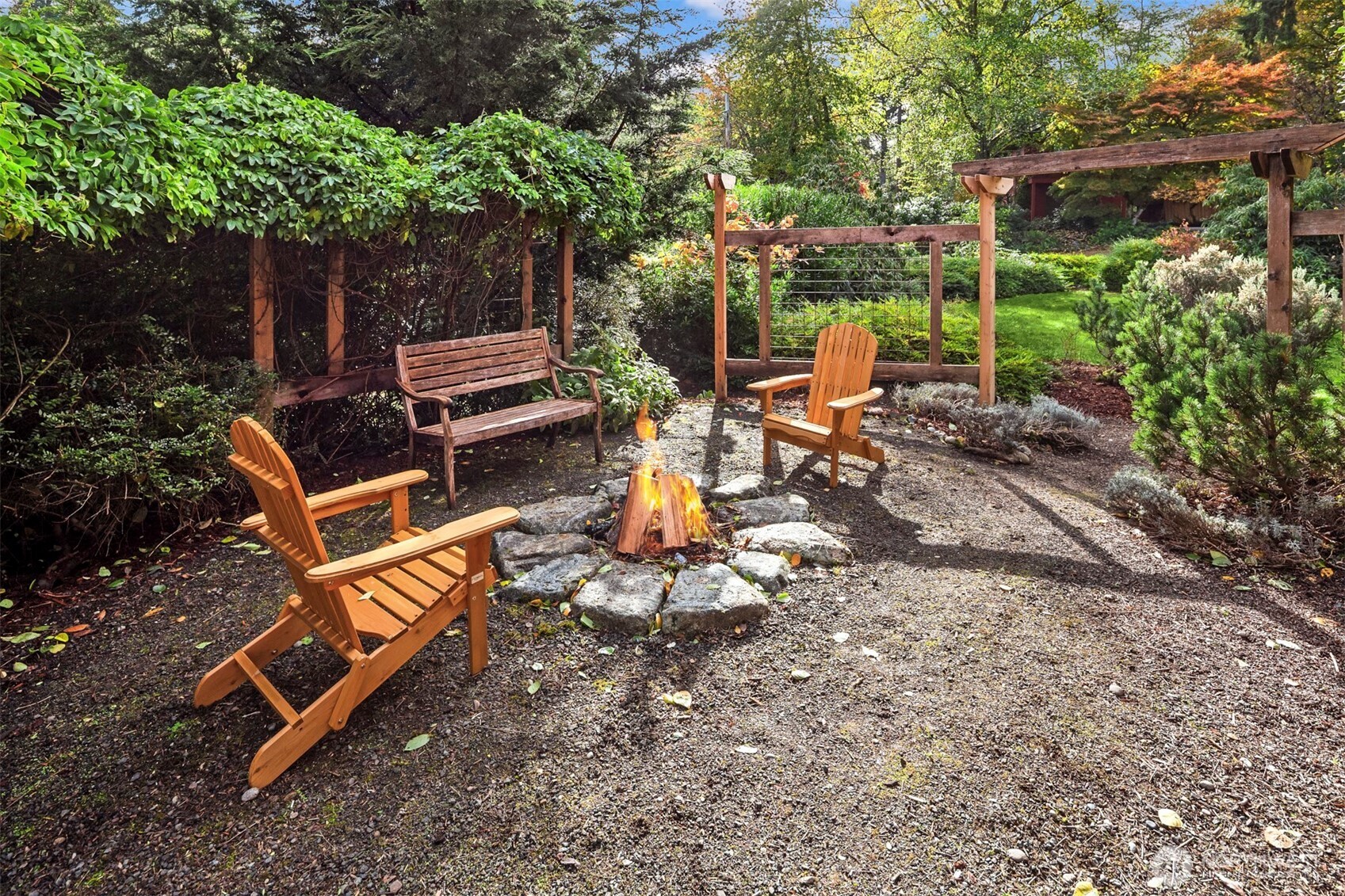 10514 Southwest 110th Street Vashon, WA 98070 - Photo 33 of 38 a backyard of a house with table and chairs