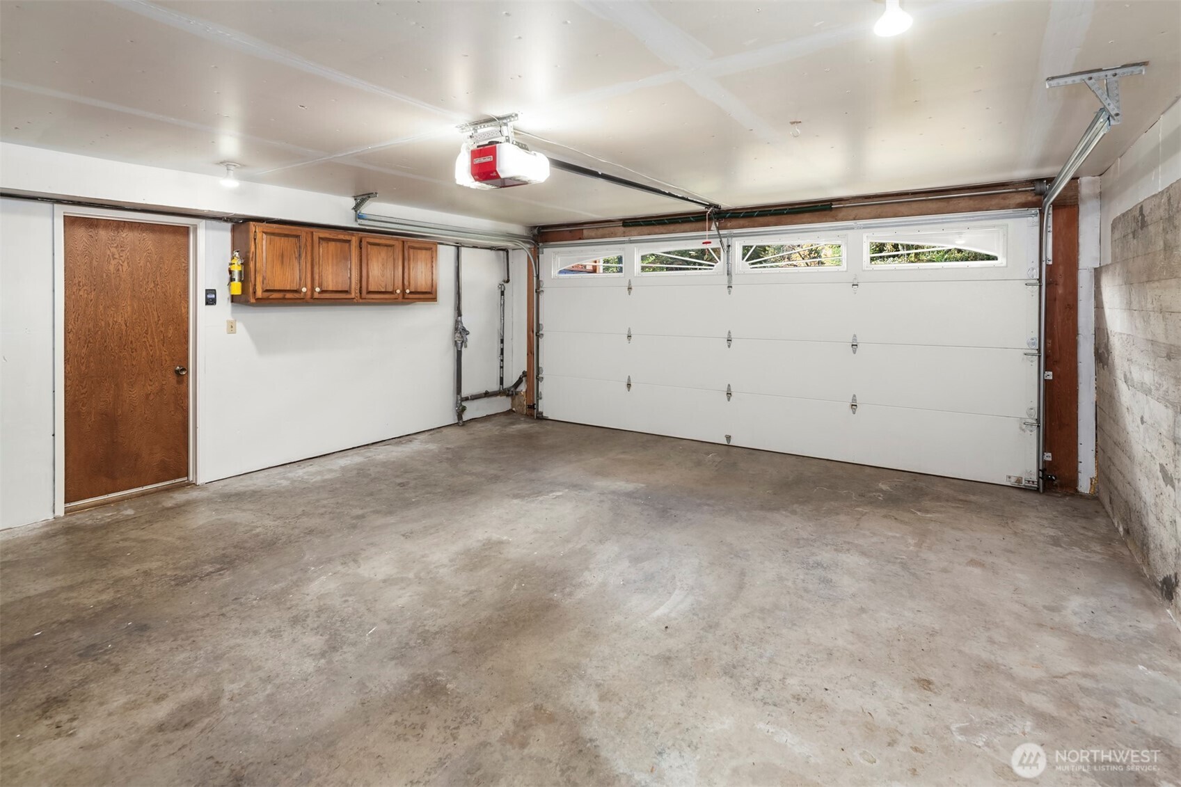 10514 Southwest 110th Street Vashon, WA 98070 - Photo 35 of 38 an empty room with ceiling fan and windows