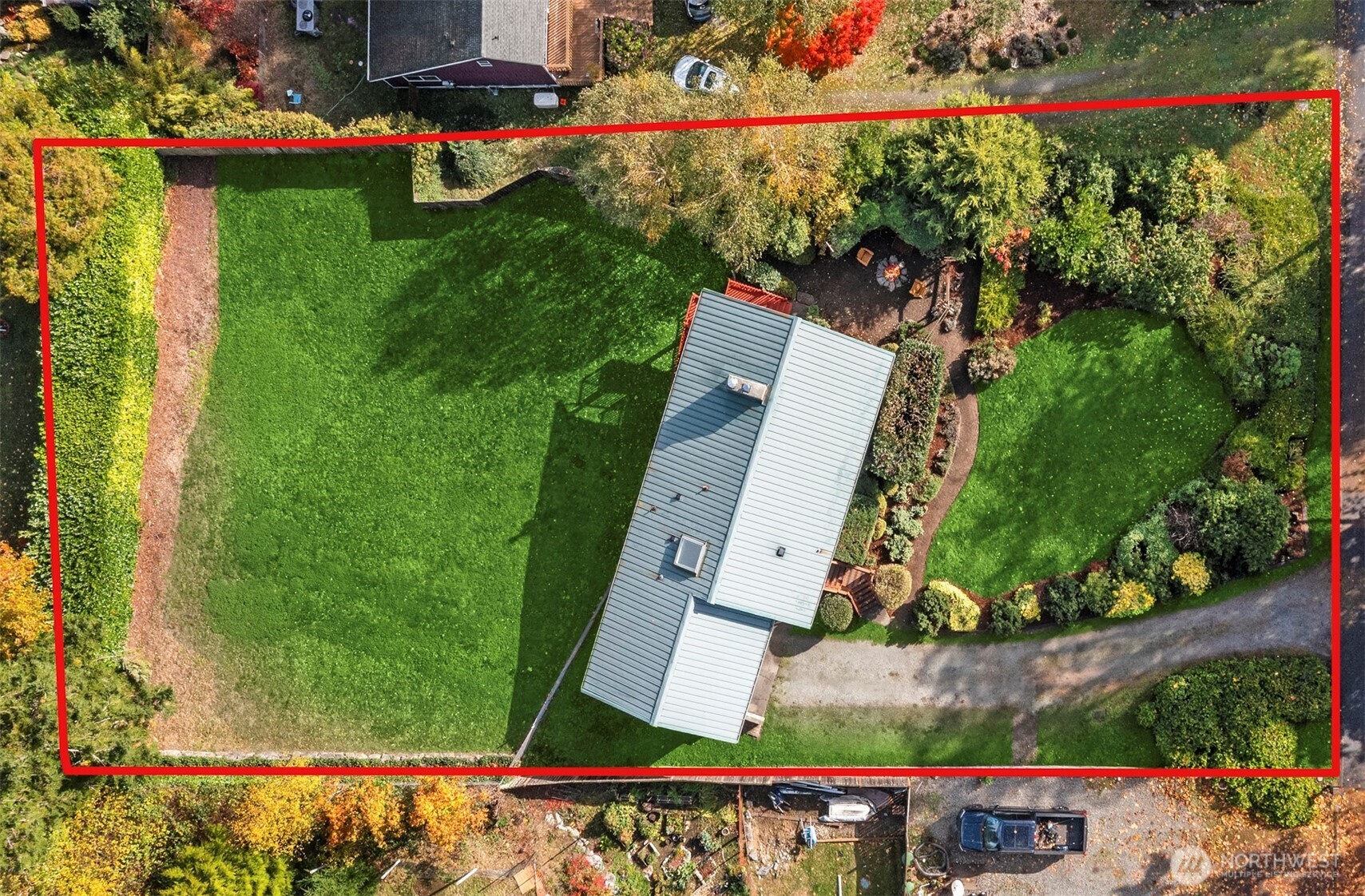 10514 Southwest 110th Street Vashon, WA 98070 - Photo 37 of 38 an aerial view of a house with a garden and swimming pool