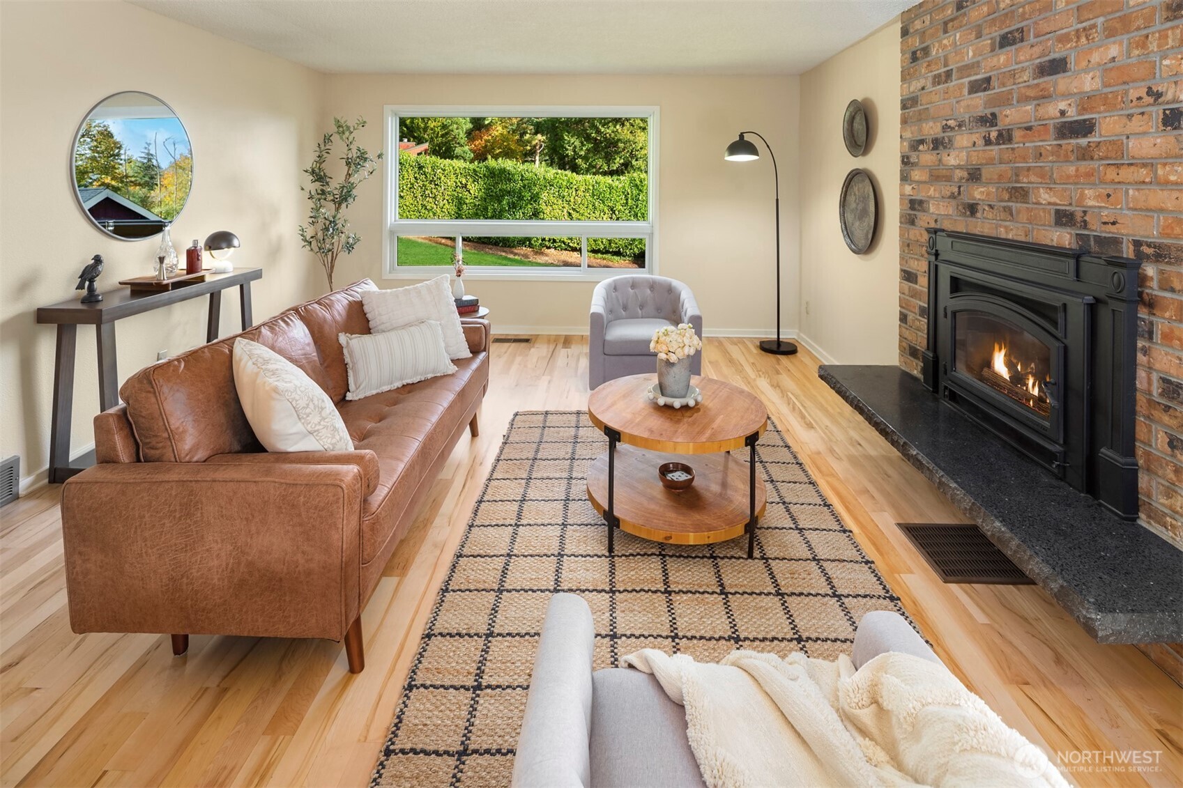 10514 Southwest 110th Street Vashon, WA 98070 - Photo 4 of 38 a living room with furniture and a fireplace