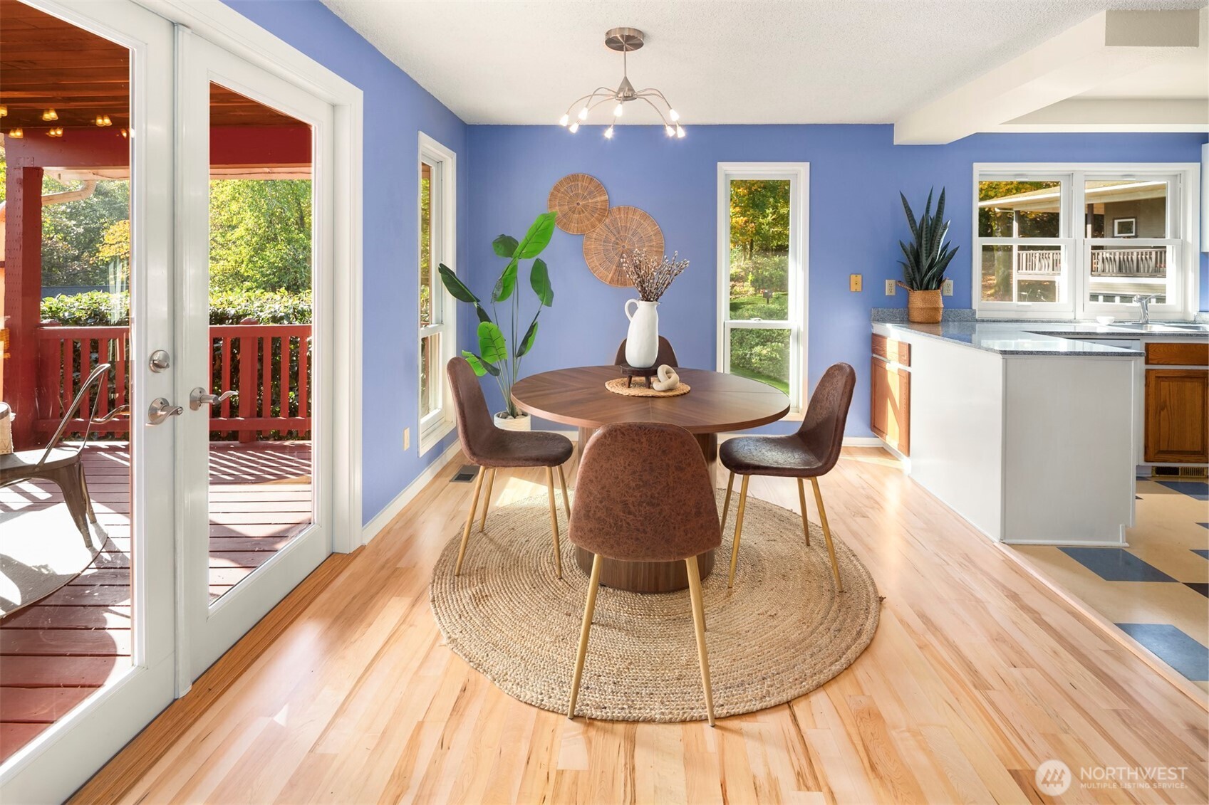 10514 Southwest 110th Street Vashon, WA 98070 - Photo 9 of 38 a dining room with furniture a livingroom view and wooden floor