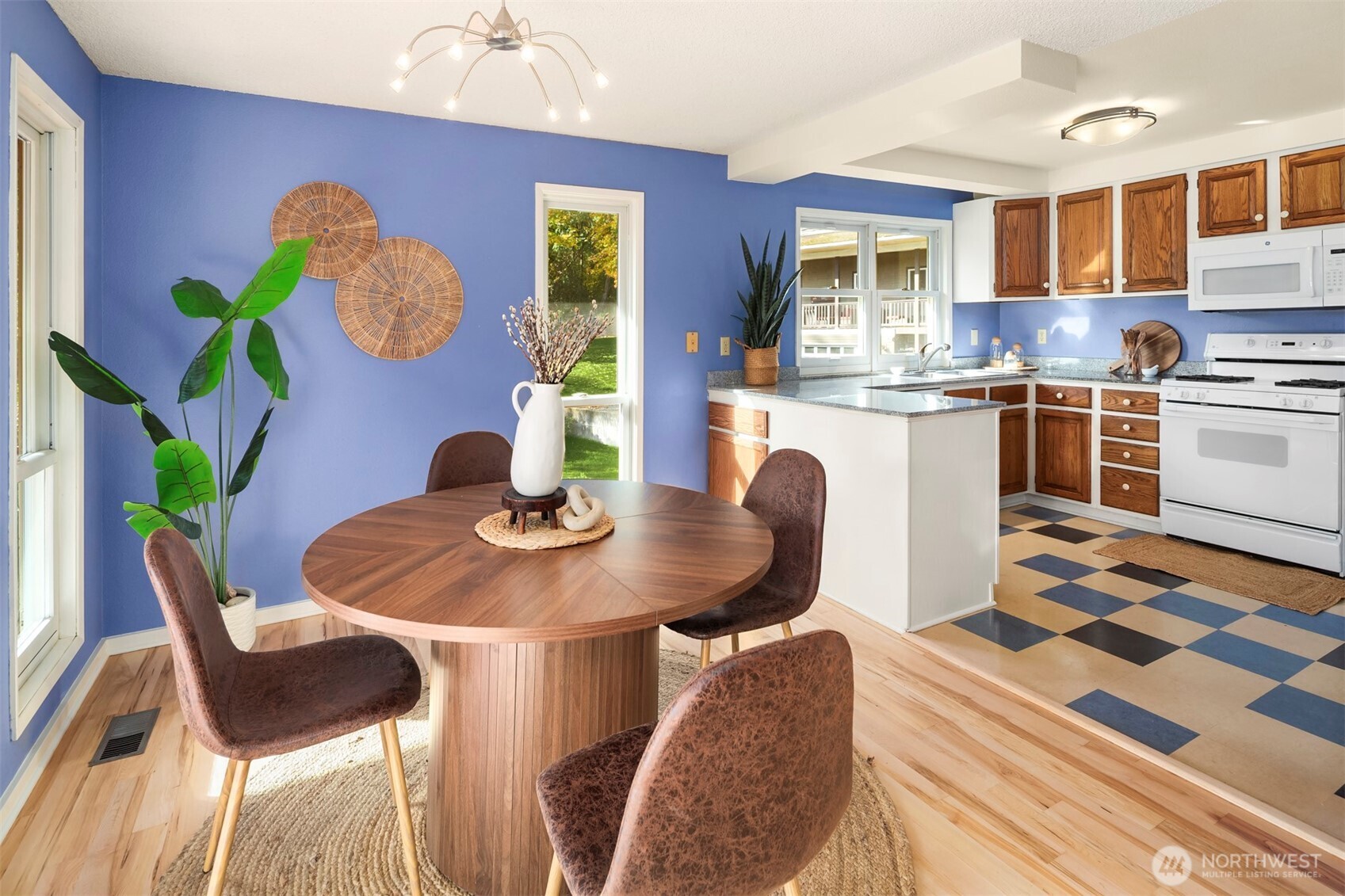 10514 Southwest 110th Street Vashon, WA 98070 - Photo 10 of 38 a dining room with furniture and wooden floor