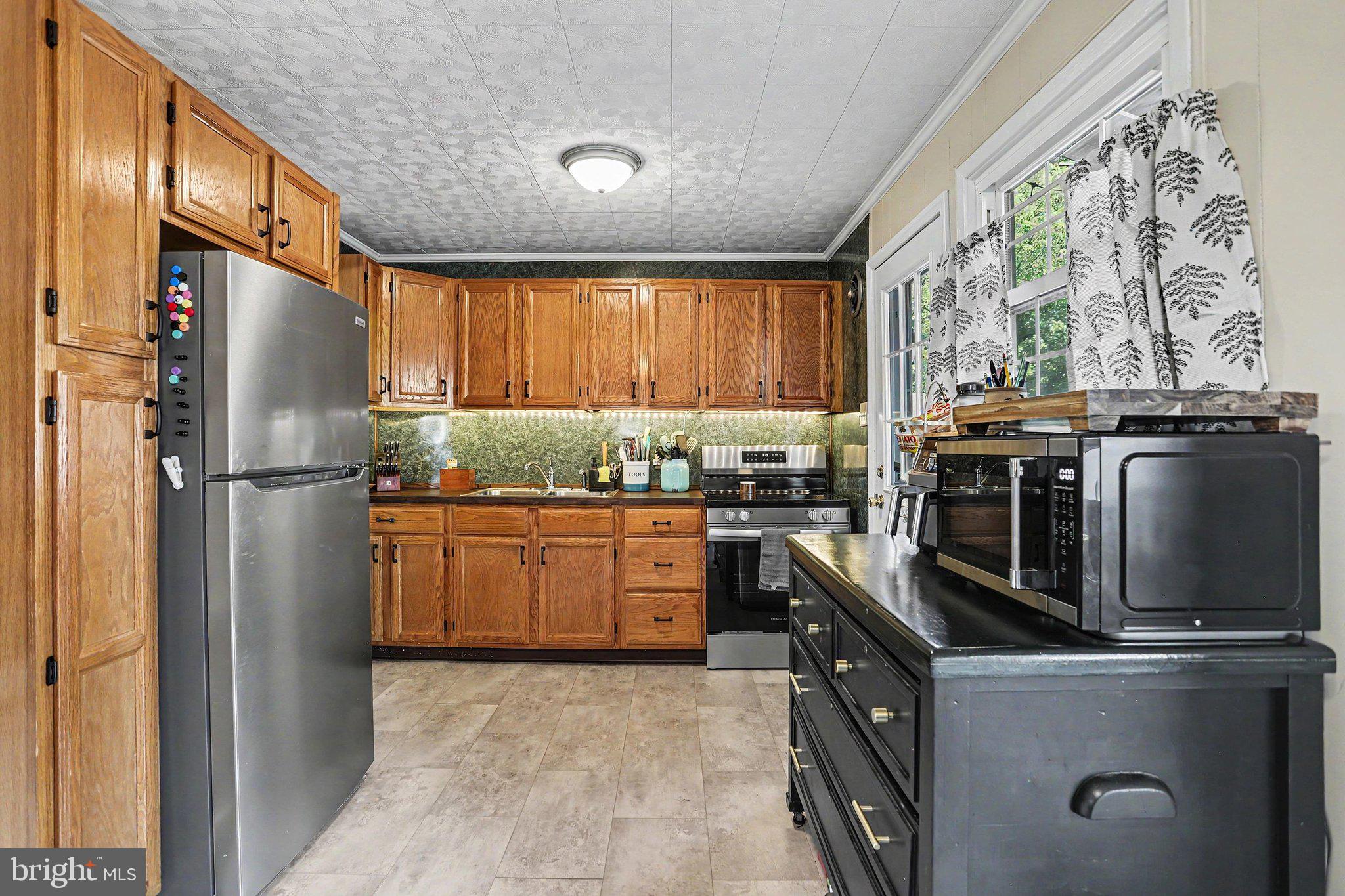 756 Fireside Road York, PA 17404 - Photo 11 of 29 Charming kitchen with warm wood tones.