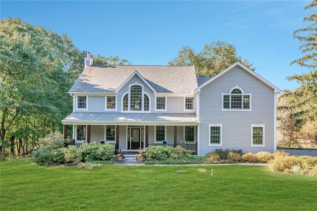 Stunning custom built Colonial beautifully set upon 1.5+ acres of parklike property