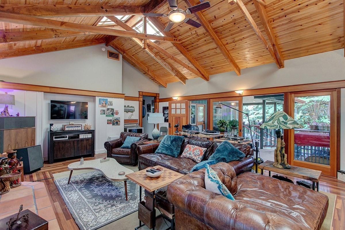 19-4242 Wright Road Volcano, HI 96785 - Photo 15 of 30 a living room with furniture and a floor to ceiling window