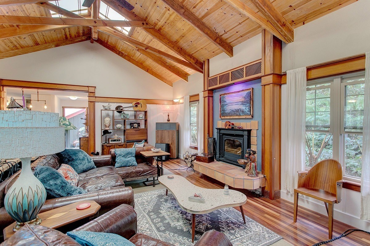 19-4242 Wright Road Volcano, HI 96785 - Photo 16 of 30 a living room with furniture a fireplace and a table