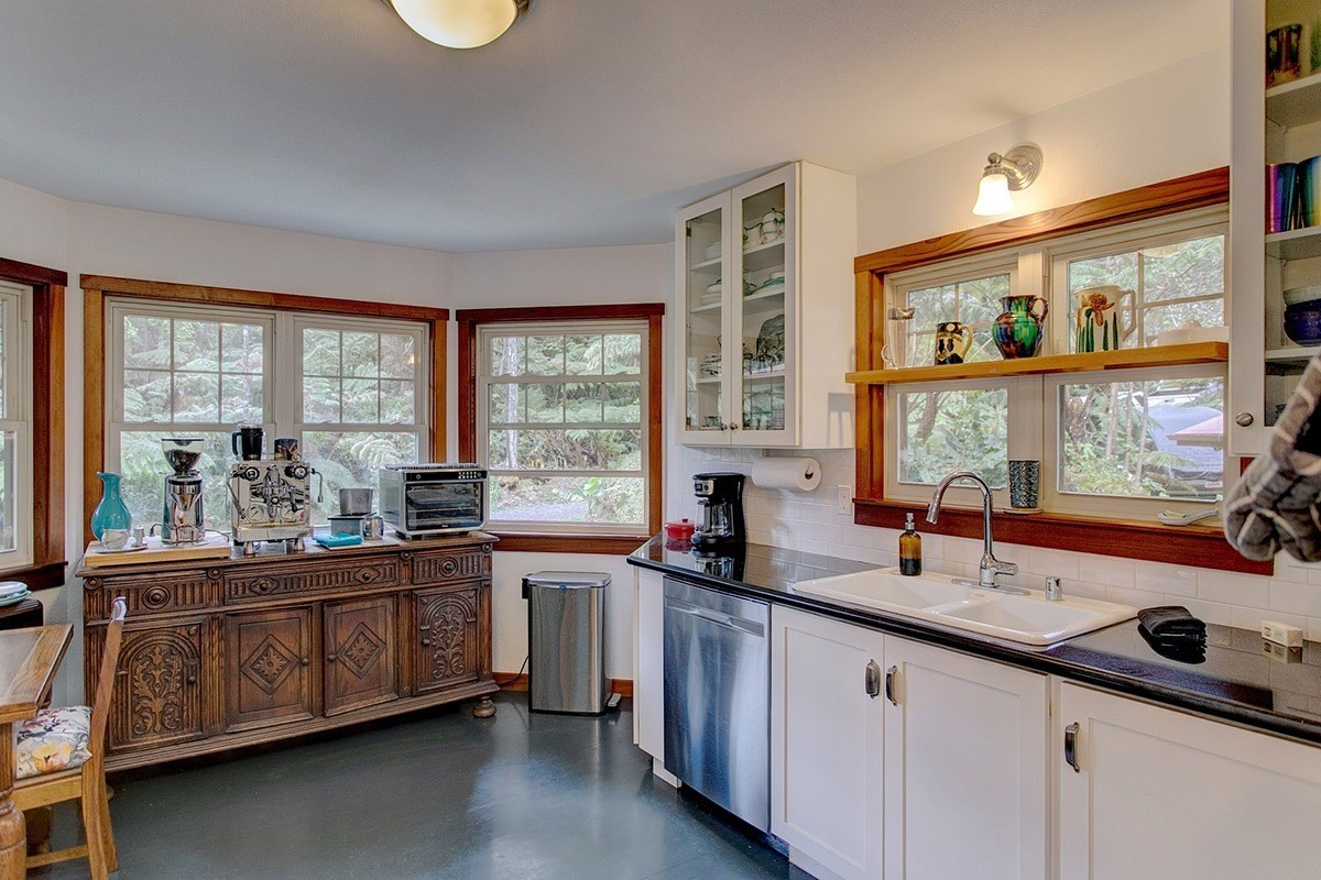 19-4242 Wright Road Volcano, HI 96785 - Photo 17 of 30 a kitchen with a sink and large window