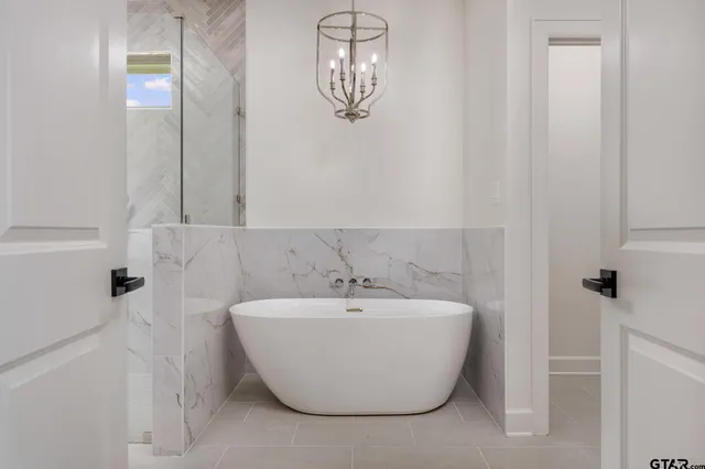a bathroom with a white sink and a mirror