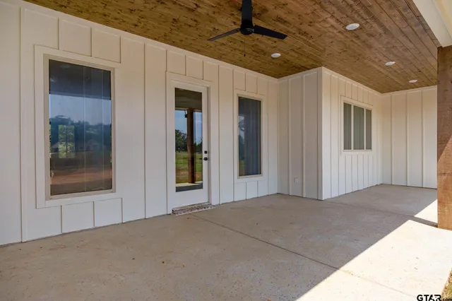 a house with swimming pool in front of it