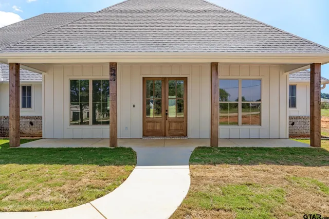 front view of a house with a yard