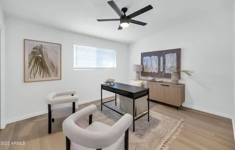 a workspace with furniture and window