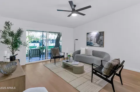 a living room with furniture and a large window