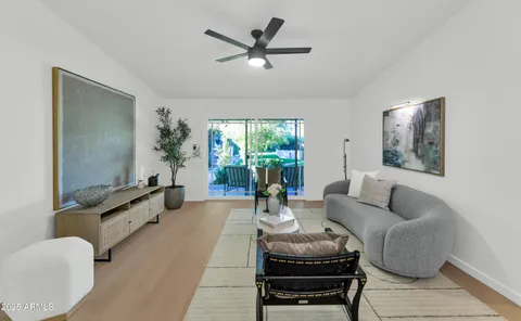 a living room with furniture and a large window