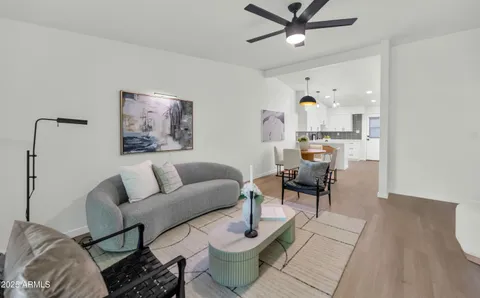 a living room with furniture and a table