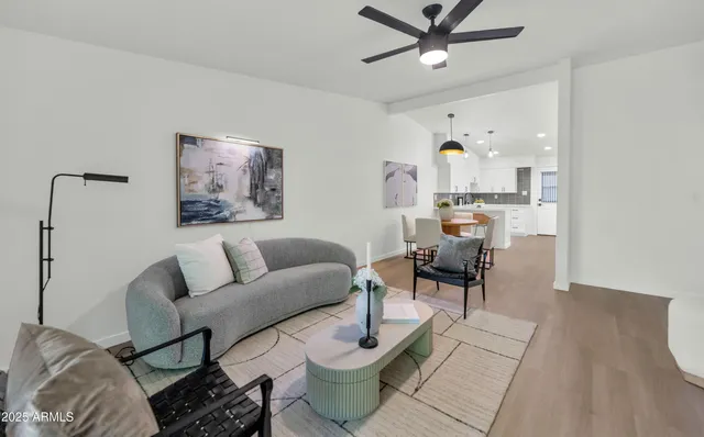 a living room with furniture and a table