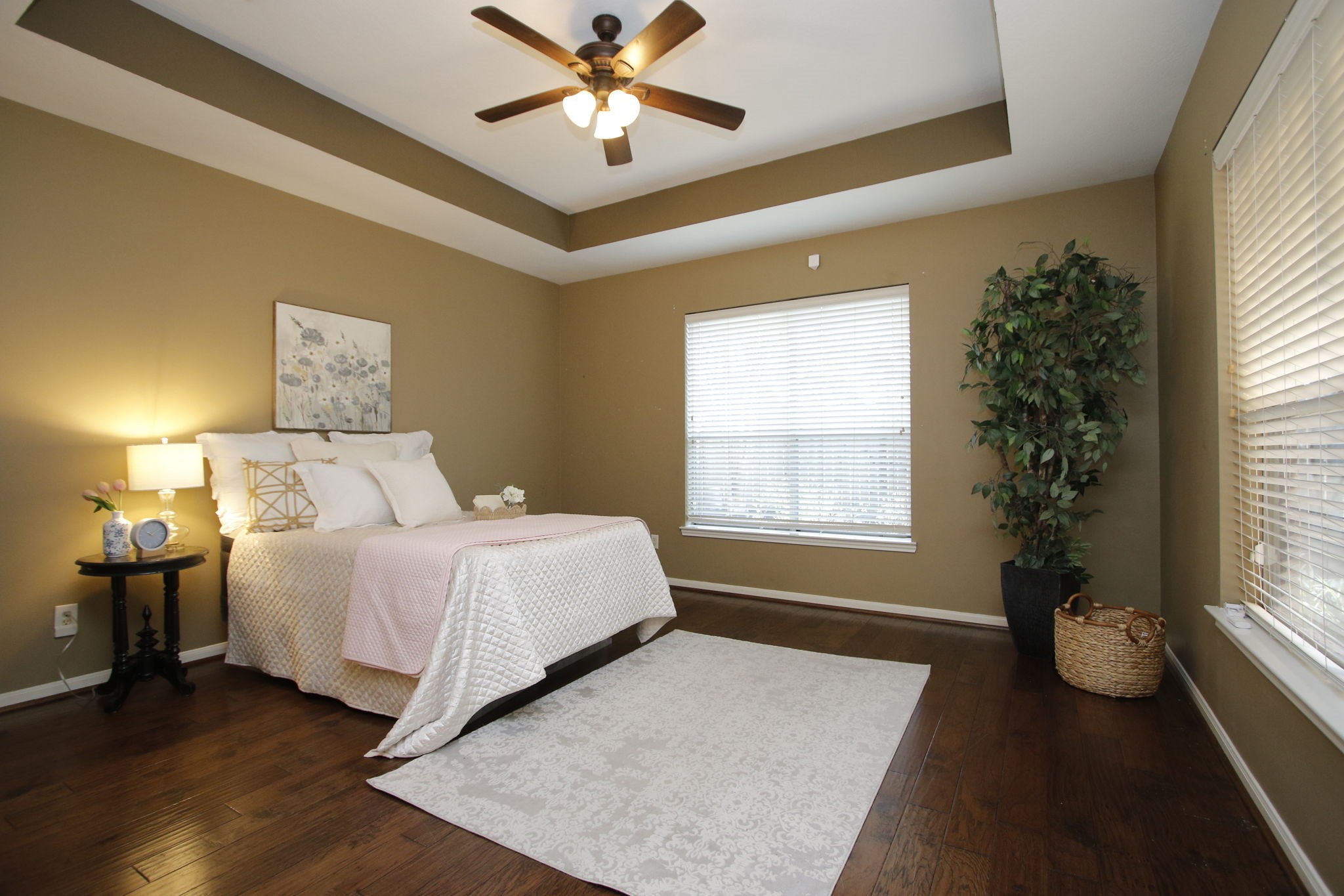 9203 Memorial Pines Way Spring, TX 77379 - Photo 21 of 45 The primary bedroom features warm, neutral walls and rich hardwood floors.