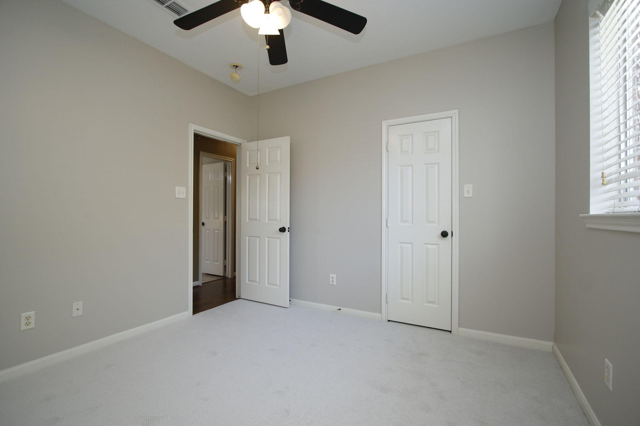 9203 Memorial Pines Way Spring, TX 77379 - Photo 29 of 45 This is another view of the bedroom that features neutral walls and light carpeting, creating a bright and welcoming space.