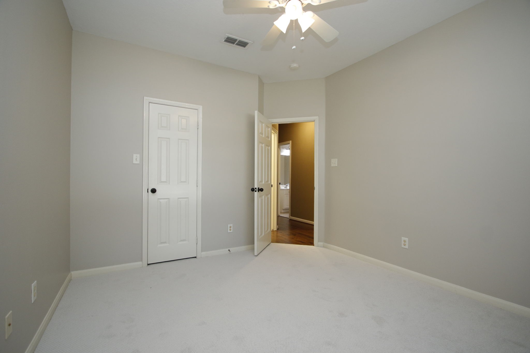 9203 Memorial Pines Way Spring, TX 77379 - Photo 31 of 45 This is another view of the front bedroom that includes a large closet and a doorway leading to the hallway.