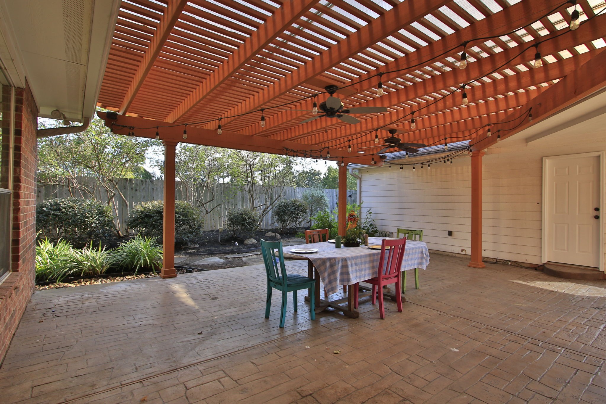 9203 Memorial Pines Way Spring, TX 77379 - Photo 37 of 45 The stamped concrete patio measures 26' x 21 feet offering a great living area outdoors.